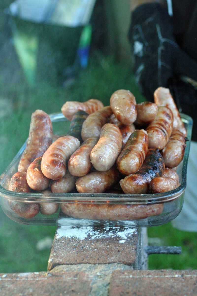 Sausages in a glass serving dish